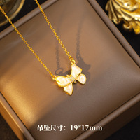Nouvel ensemble de bijoux haut de gamme et tendance pour femme : boucles d'oreilles clous et bague en acier titane plaqué or avec pendentif nœud papillon, modèle populaire sur internet