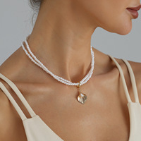 Collier superposé double couche style luxe léger français, pendentif feuille de Ginkgo, perles imitation riz, ras-de-cou pour femme, vente en gros de bijoux