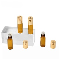 Luxuriöse 3ml 5ml 10ml Leere Zylindrische Bernsteinfarbene Glasrollerflasche mit Kreuzanhänger für Parfüm, Ätherische Öle und Kosmetikverpackungen