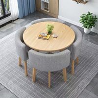 Ensemble de table à manger moderne et simple, table ronde avec chaises entièrement rétractables pour usage domestique ou de négociation en petit espace