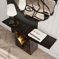 Console contemporaine inspirée des formations karstiques, en placage d'ébène de Macassar, avec finition extérieure en laiton poli et intérieur moderne, pour couloir.