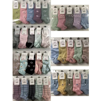 Chaussettes unies pas chères pour hommes et femmes, blanches et noires, pour usage quotidien, vente en gros pour les marchés de rue
