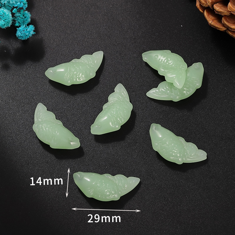 7 petits poissons vert clair 14*29mm