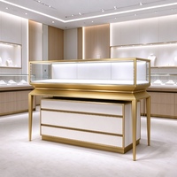 Vitrine de présentation de bijoux moderne sur mesure, vitrine à bijoux en verre avec cadre doré et tiroirs de rangement pour boutique de montres