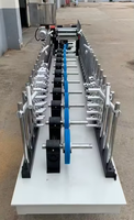 Machine automatique d'enveloppement de profilés en bois MDF pour la production de cadres de portes, la lamination de placages en papier et la fabrication de moulures de meubles