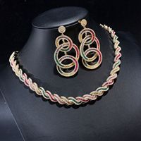 Parure de bijoux Rétro en Zirconium à motif spirale, dorée, comprenant un collier, des boucles d'oreilles chandelier à triple anneaux entrelacés et un bracelet