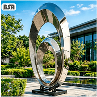 Sculpture d'extérieur BSA en acier inoxydable à double anneau abstrait, poli miroir, en métal perforé, statue d'art circulaire pour jardin et hôtel