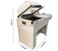 Machine d'emballage sous film rétractable à petit budget pour petites boîtes, avec découpe aux 4 coins et chambre de rétraction thermique
