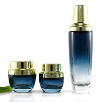 Lot de contenants cosmétiques haut de gamme en verre bleu dégradé, flacon pompe pour lotion, pot de crème pour le visage, gravure et marquage à chaud pour soins de la peau