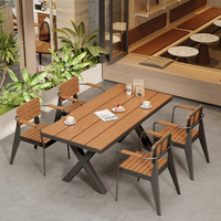 Mobilier d'extérieur pour la restauration : Table et chaises de salle à manger en acier inoxydable pour terrasse, idéal pour les projets commerciaux de cafés et la vente en gros.