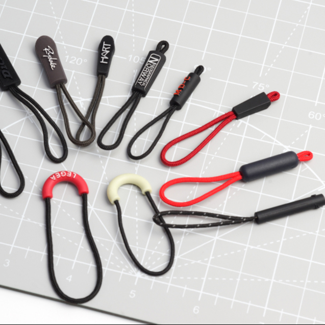 custom logo metal 3d clear triangle rubber zipper puller with tumb by the yard