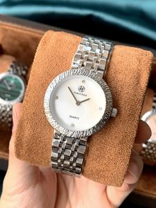 New women's wristwatch with high aesthetic quality mother-of-pearl <b>face</b> and steel band - Product Image 6