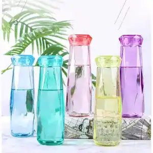 Crystal Infused Gem Water Bottle Wellness Botella 500ml de agua de vidrio al por mayor Botella de agua de vidrio de piedra de color