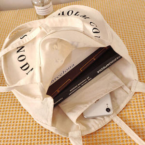 Sac seau en toile blanc décontracté et simple, personnalisable, réutilisable, écologique, pour étudiants, avec personnalisation de marque, esthétique et pratique - Product Image 4