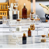 Mini présentoir de produits de haute qualité Figurine étagée multicouche en acrylique transparent et étagère montante d'affichage de cosmétiques