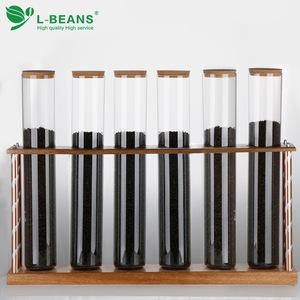 Exhibidor de Té L-Beans con Frascos de Vidrio y Base de Madera para Uso en Exhibiciones - Product Image 1