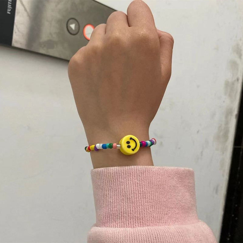 Collier visage souriant