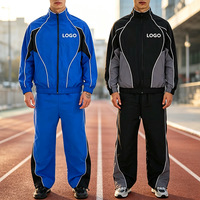 Ensemble de survêtement décontracté 2 pièces pour homme avec logo personnalisé, blocs de couleur, rayures, fermeture éclair intégrale, col montant et pantalon large style streetwear