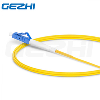 Harga pabrik OEM FC/APC ke LC/UPC Simplex OS2 Mode tunggal kabel Patch serat optik 2.0mm PVC