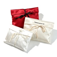 Pochette de rangement pour bijoux en satin de luxe personnalisée avec nœud papillon, sac de voyage pliable portable en soie douce, sac de rangement pour perruques et cheveux