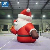 Père Noël gonflable géant personnalisé pour la décoration de centres commerciaux en plein air lors des événements de Noël