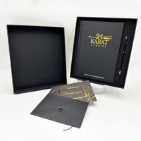 Vente en gros de papeterie A5 personnalisée avec jeu de stylos Emballage cadeau en carton avec logo en feuille d'or Boîte rigide en papier noir Carnet de notes