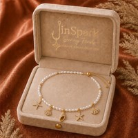 Collier tendance JinSpark avec pendentif perle étincelante, en acier inoxydable plaqué or, motif étoile de mer et coquillage, pour femme