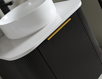 Meuble-lavabo flottant moderne noir mat cannelé avec vasque à poser et miroir rond rétroéclairé par LED pour appartement