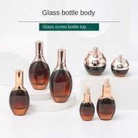 Youbo Großhandel Runde Seeglas-Flasche mit Pipette Farbspray Anpassbare Bedruckung Hautpflege Ätherisches Öl Creme Lotion