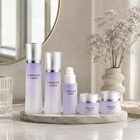 Bouteilles et pots cosmétiques cylindriques haut de gamme en verre à bouchon conique évasé pour ensemble de soins de la peau premium 30g 50g 40ml 100ml 120ml
