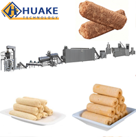 Ligne de production d'équipements d'extrusion entièrement automatiques pour la fabrication de snacks soufflés fourrés