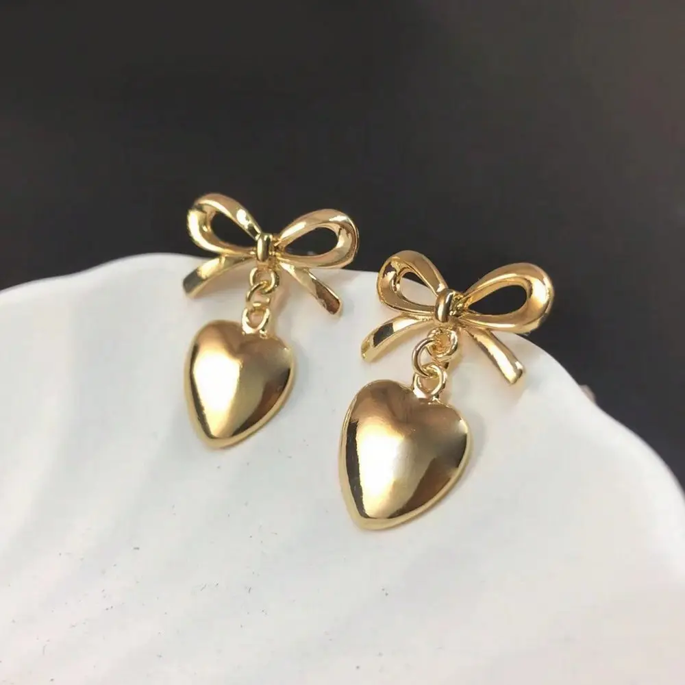 Pendientes colgantes de lazo de corazón de oro romántico dulce con textura metálica de moda para regalo de San Valentín