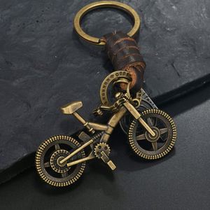 Llavero de metal retro para bicicleta con colgante de aleación de bronce con cara sonriente y estrella hexagonal, de cuero trenzado, regalo creativo, venta al por mayor - Product Image 2