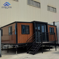 Maison conteneur de luxe extensible à double aile en acier de 20 et 40 pieds avec porte vitrée, villa modulaire préfabriquée, entrepôt, résidence de villégiature