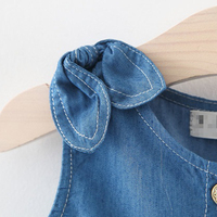 Robe d'été sans manches en denim de coton avec boutons et nœud pour bébé fille robe de princesse à la mode pour bébé nouveau style vente en gros