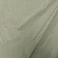 Tissu en taffetas froissé de nylon 20D semi-transparent, doux, chaud et respirant avec finition cirée pour doudounes et sacs d'hiver