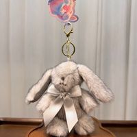 Peluche Lapin Mignon Européen en Sable 12CM, Jouet en Coton PP Doux pour Filles de 2 à 4 Ans, Cadeau de Pâques avec Nœud et Porte-clés