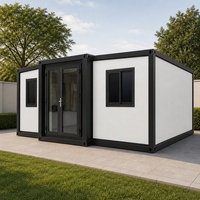 Maison modulaire blanche en conteneur préfabriqué, cabane de jardin avec portes à cadre noir pour projets résidentiels