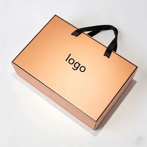 Boîte cadeau rigide en abricot personnalisable en direct d'usine avec poignées noires, idéale pour les vêtements et l'emballage de cadeaux haut de gamme - Product Image 1