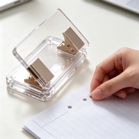 Perforatrice de bureau en acrylique transparent à 2 trous avec clip métallique doré pour carnets, classeurs et fournitures de bureau – Vente en gros usine