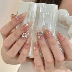 Meilleures ventes : <span class=keywords><strong>Faux</strong></span> <span class=keywords><strong>ongles</strong></span> portables faits main, design nœud en forme de cœur, chaîne perlée, lot de 30 pièces, prêts à poser - Product Image 1