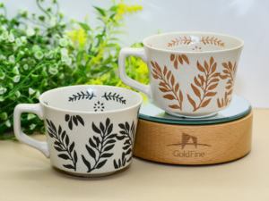<span class=keywords><strong>Mug</strong></span> en céramique à imprimé feuilles botaniques, finition rustique mouchetée pour café et thé - Product Image 1