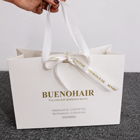 Sac cadeau en papier enduit avec poignée en ruban biodégradable de luxe, avec logo personnalisé en relief, emballage pour vêtements