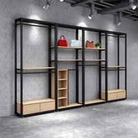 Présentoir de vêtements en métal noir avec logo personnalisé pour magasin de vêtements pour hommes, support de présentation de costumes pour hommes, présentoir de vêtements de vente au détail