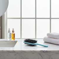 Logo privé pagaie à poils en nylon noir résistant à la chaleur et massage à coussin d'air démêlant brosse à cheveux sèche-cheveux