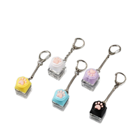 En gros : Porte-clés clavier lumineux, jouet anti-stress à pression, clavier en forme de patte de chat, jouets de décompression, cadeaux anti-stress