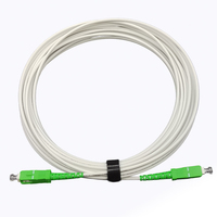 Penjualan Panas DIMAN White Simplex SC/APC G652D Fiber Patch Cord Single Mode FTTH Drop Cable Jumper untuk Jaringan Telekomunikasi.