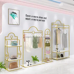 Vente en gros d'étagères modernes en acier inoxydable pour magasin de vêtements <span class=keywords><strong>Boutique</strong></span> présentoirs à vêtements de style européen pour magasin de détail - Product Image 1