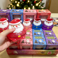 Jouet Squishy Père Noël multicolore festif et très populaire, emballé individuellement dans une boîte cadeau, idéal pour les cadeaux de Noël