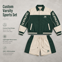Ensemble de survêtement homme tendance 2026 : Veste et short de coach personnalisés en blocs de couleurs vert forêt et crème, directement de l'usine